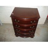 A MODERN REPRODUCTION SERPENTINE FRONTED FOUR DRAWER CHEST
