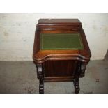 A LEATHER INLAID DAVENPORT DESK