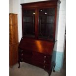 A MAHOGANY INLAID WIDE BUREAU BOOKCASE WITH QUEEN ANNE LEGS