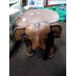 A CARVED ELEPHANT STOOL