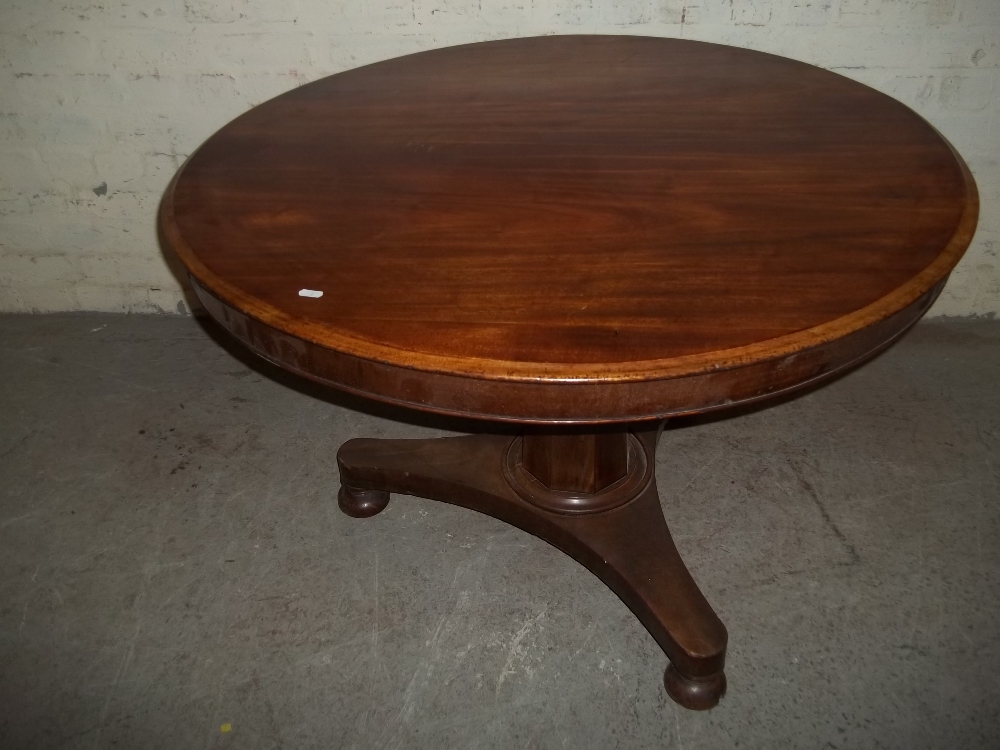 AN ANTIQUE FLIP TOP GEORGIAN STYLE DINING TABLE