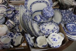 A LARGE QUANTITY OF BLUE AND WHITE CERAMICS TO INCLUDE LARGE MEAT PLATES, WILLOW PATTERN EXAMPLES