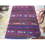 AN AFGHAN WOOLLEN RUG 175 X 122 CM