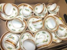 A TRAY OF VINTAGE FLORAL GILDED CHINA CUPS AND SAUCERS ETC.