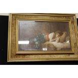 A GILT FRAMED AND GLAZED PARTIALLY OVER PAINTED PRINT OF A WOMAN RESTING BY PAUL TILLIER PICTURE