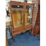 A 20TH CENTURY BURR WALNUT GLAZED DISPLAY CABINET WITH DRAWERS RAISED ON CABRIOLE SUPPORTS H-159 W-