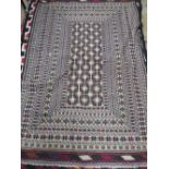 AN AFGHAN WOOLLEN RUG 188 X 126 CM