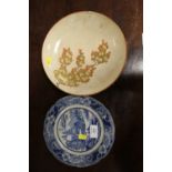 A JAPANESE CERAMIC BOWL - RESTORED, TOGETHER WITH A BLUE AND WHITE PLATE (2)