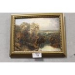 A GILT FRAMED OIL ON BOARD OF A COUNTRY RIVER LANDSCAPE SIGNED J.E. READ VERSO 15CM X 20CM