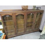 A VINTAGE OAK GLAZED BOOKCASE W-180 CM S/D