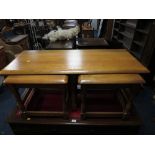 A LIGHT OAK NEST OF ERCOL STYLE TABLES (3)