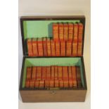 A MINIATURE SET OF THE WORKS OF WILLIAM SHAKESPEARE, red leather, published by Allied Newspapers