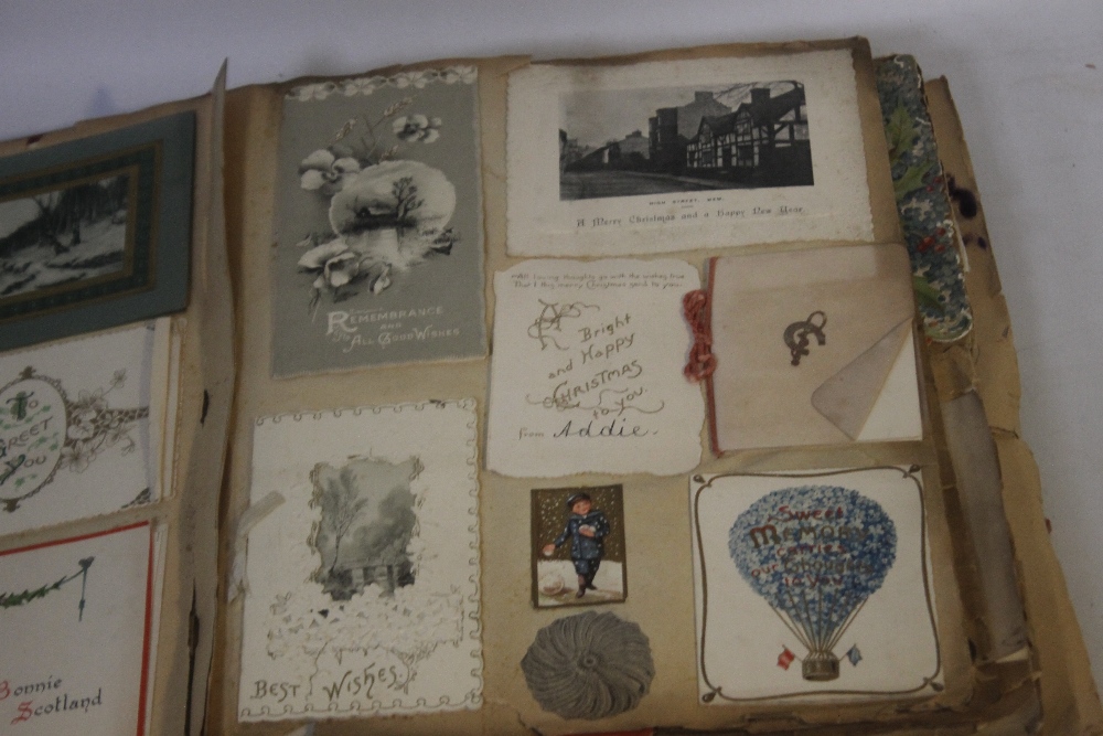 AN EDWARDIAN SCRAP BOOK CONTAINING A COLLECTION OF GREETINGS CARDS, to include various dated - Image 3 of 10