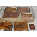 A TRAY OF ANTIQUARIAN BOOKS to include three wood covered middle eastern books, one including