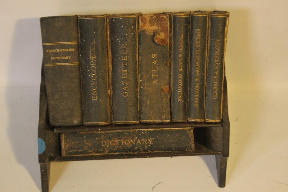 AN OAK MINIATURE BOOKSHELF WITH SET OF ASPREY & CO. LTD. REFERENCE LIBRARY BOOKS, comprising