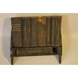 AN OAK MINIATURE BOOKSHELF WITH SET OF ASPREY & CO. LTD. REFERENCE LIBRARY BOOKS, comprising