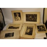 A FOLIO OF VARIOUS ENGRAVINGS DEPICTING BUILDINGS, PORTRAITS ETC, to include a street scene