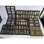 A QUANTITY OF ALBUMS OF ASSORTED CIGARETTE CARDS, to include Film Stars, Military, Natural History