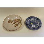 A JAPANESE CERAMIC BOWL - RESTORED, TOGETHER WITH A BLUE AND WHITE PLATE (2)