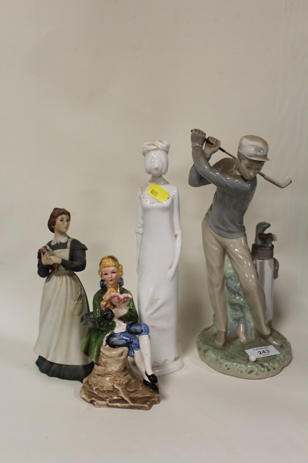 A LLADRO GOLFING FIGURE TOGETHER WITH A SPODE HENRIETTA FIGURE, A FRANKLIN PORCELAIN JO FROM