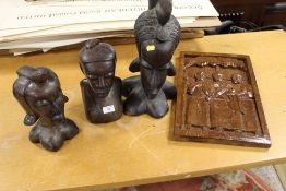 THREE LARGE AFRICAN TRIBAL ART CARVED WOODEN BUSTS TOGETHER WITH A CARVED WOODEN PANEL