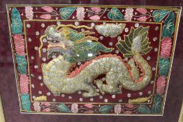 A FRAMED AND GLAZED ORIENTAL STYLE NEEDLEWORK OF A DRAGON, TOGETHER WITH A PRINT OF A WARRIOR ON