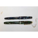 A CONWAY STEWART DINKIE 550 GREEN MARBLE PEN TOGETHER WITH A BLUE MARBLE 550 EXAMPLE - MISSING CLIP