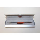 A CASED ROTRING NEWTON PROPELLING PENCIL