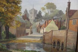 A GILT FRAMED OIL ON CANVAS OF A VILLAGE SCENE SIGNED REGINALD RILEY 26CM X 36CM