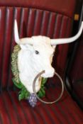 A LARGE CAST METAL WALL MOUNTED BULL TETHER / TOWEL RING