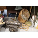 A CARVED WOODEN MODEL OF A CANNON, L 53 CM TOGETHER WITH A WICKER BASKET, TABLE LAMP ETC (5)
