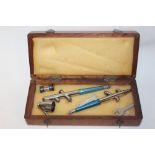 A CASED VINTAGE BADGER DOUBLE AIRBRUSH SET