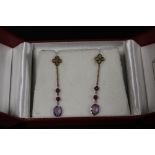 A PAIR OF 9CT GOLD AND AMETHYST DROPPER EARRINGS