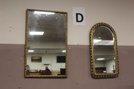 A GILT FRAMED RECTANGULAR WALL MIRROR TOGETHER WITH AN ARCH TOPPED EXAMPLE (2)
