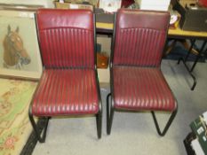 A PAIR OF MODERN OXBLOOD LEATHER DINING CHAIRS