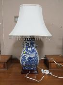 A LARGE MODERN BLUE AND WHITE TABLE LAMP AND SHADE OVERALL H-79 CM