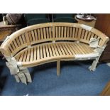 A MODERN COLONIAL STYLE HARDWOOD CURVED GARDEN BENCH W-158 CM