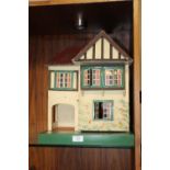 A VINTAGE HAND PAINTED WOODEN DOLLS HOUSE WITH DOLLS HOUSE FURNITURE