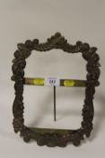 A VINTAGE BRASS STRUT BACK PICTURE FRAME - H 37 CM