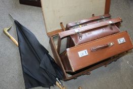 A COLLECTION OF VINTAGE LEATHER SUITCASES TOGETHER WITH A WALKING STICK AND UMBRELLA