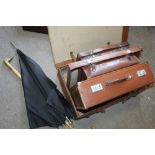 A COLLECTION OF VINTAGE LEATHER SUITCASES TOGETHER WITH A WALKING STICK AND UMBRELLA