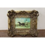 A GILT FRAMED PORCELAIN PLAQUE OF A TROTTING SCENE - STAMPED VIENNA TO REVERSE