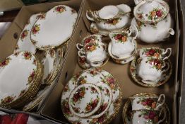 TWO TRAYS OF OLD COUNTRY ROSES CHINA TO INCLUDE A TEAPOT, TRIOS, SIDE PLATES ETC