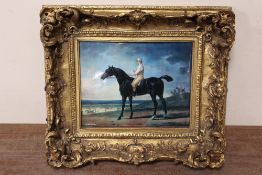 A GILT FRAMED PORCELAIN PLAQUE OF A HORSE AND JOCKEY - STAMPED VIENNA TO REVERSE