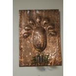 AN ART DECO STYLE COPPER WALL PLAQUE