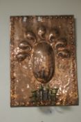 AN ART DECO STYLE COPPER WALL PLAQUE