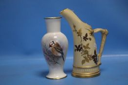 A HAND PAINTED VASE BY G.DELANEY DEPICTING A GOLD FINCH SIGNED TO THE LOWER LEFT BY DELANEY TOGETHER