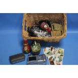 A BASKET OF ASSORTED COLLECTIBLES TO INCLUDE A CAMERA, CIGARETTE CARDS, MATCH BOX HOLDER ETC