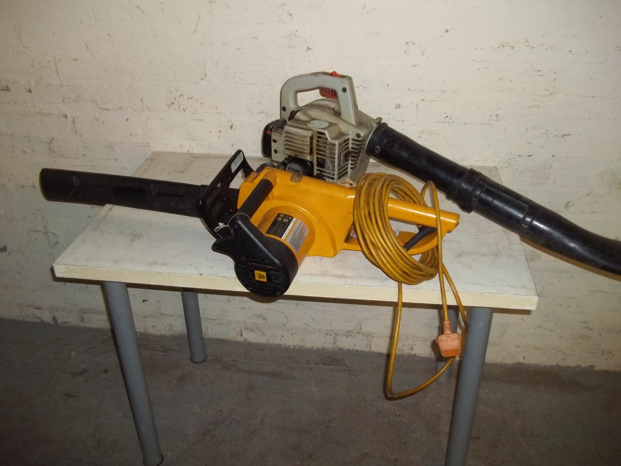 A PETROL LEAF BLOWER AND AN ELECTRIC CHAINSAW