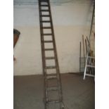 A VINTAGE WOODEN LADDER